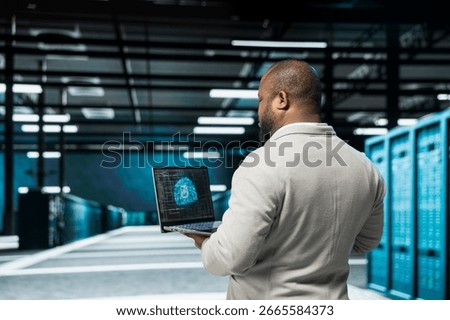 Admin in data center using artificial intelligence computing simulating human brain thought processes in computerized model. IT professional working with AI machine learning algorithms