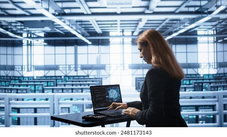 Admin in data center works with artificial intelligence computerized model simulating human brain. Employee working on notebook with AI machine learning algorithms using pattern recognition, camera B