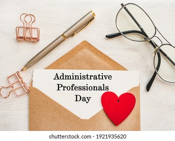 Admin Day Greeting Card. Close-up, view from above, wooden surface. Concept of preparation for a professional holiday. Congratulations for relatives, friends and colleagues