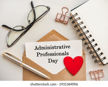 Admin Day Greeting Card. Close-up, view from above, wooden surface. Concept of preparation for a professional holiday. Congratulations for relatives, friends and colleagues - Shutterstock ID 1931369096