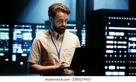 Admin reconfiguring server farm to optimize it for data processing requirements of artificial intelligence workloads. Expert checking neural network data center used for machine learning - Powered by Shutterstock - Get 15% off with code: PIKWIZARD15