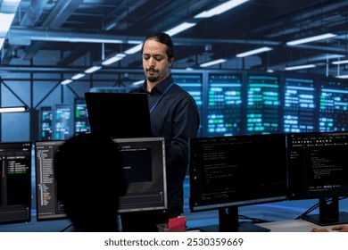 Admin in server hub checking recovery plan, monitoring data center energy consumption across components, making sure sensors are functioning optimally, doing routine disk checks