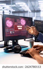 Admin in server hub trying to protect hardware from hacker attack stealing sensitive information. Data center employee struggling to erase virus after seeing security breach alert on monitor