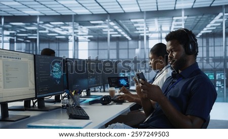 Admin in server room using mobile phone, relaxing after ensuring minimal downtime. Data center IT expert texting on smartphone, taking break from monitoring performance, camera A