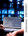 Admin team maintaining and updating server rigs, writing lines of code on laptop terminal, close up. Coders using JavaScript, Java, and database programming to ensure seamless data center computing