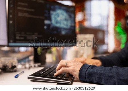 Admin typing on PC keyboard in startup office, coding advanced AI algorithm and machine learning models enhancing automation. Close up of IT professional using computer in Silicon Valley workplace
