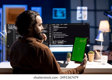 Admin using isolated screen tablet to filter malicious traffic from cybercriminals attempting to corrupt company data. IT expert working on mockup portable device, preventing malware attacks
