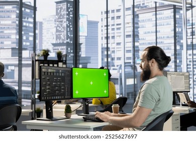 Admin using mockup computer, testing machine learning company software to minimize occurrence of bugs, identifying bottlenecks. Man writing clean, efficient code on green screen PC to reduce errors
