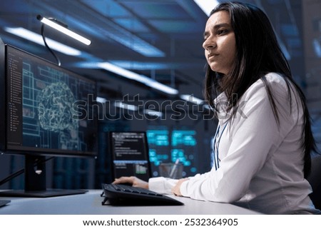 Admin working on PC in data center with artificial intelligence technology to process massive datasets. Worker solving tasks in server hub storing data used for deep learning