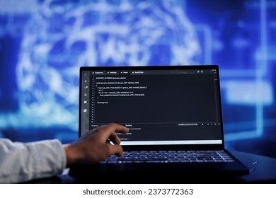 Admin writes code on laptop to visualize artificial intelligence neural networks using augmented reality technology, close up. Expert running AI script for data processing, blurry background
