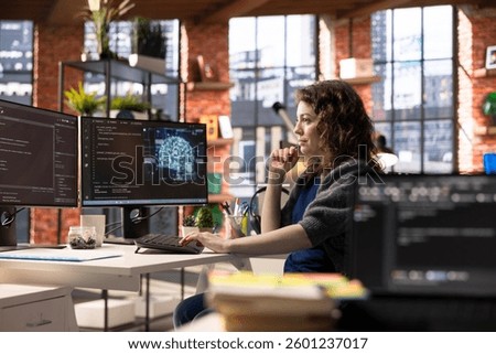 Admin writing code on PC and doing maintenance on artificial intelligence neural networks computerized model. Woman tech support expert doing checkup on AI systems, data science.