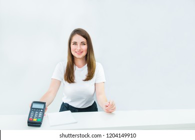 Administrative Manager Or Seller Holding Payment Terminal At Reception Desk. Contactless Payment With Nfc Technology At Shop, Clinic, Hotel. Mobile Payment PayPass. Copy Space. White Background