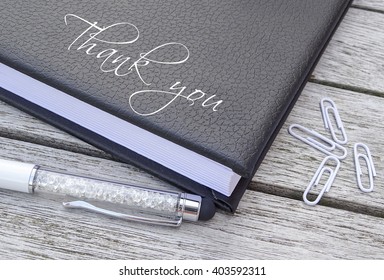 Administrative Professionals Day.
Thank You Written On Agenda.