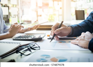Administrator business man financial inspector and secretary making report, calculating balance. Internal Revenue Service checking document. Audit concept - Shutterstock ID 574879378