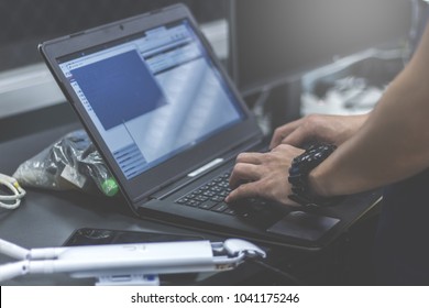 Administrator working in data center configure and check internet network on computer laptop ,Hands typing text on a laptop keyboard , Selective focus  - computer network concept - Shutterstock ID 1041175246