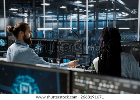 Admins in high tech data center installing upgraded server racks systems helped by AI technology. Server room IT specialists upgrading enterprise networks gear using artificial intelligence