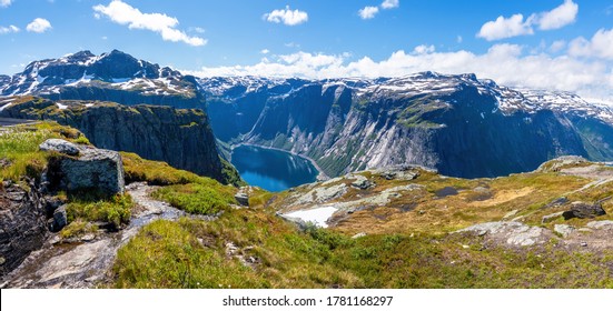 Admiring The View Of A Fjord On A Summer Day In The Hardanger Fjord National Park, Norway