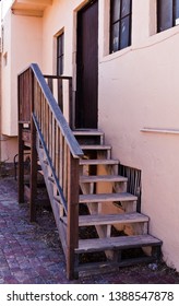 Adobe House With Wooden Stairs In New Mexico