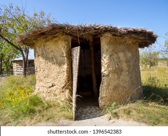 Adobe Hut With Reed Roof And Wicker Door