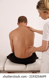 Adolescent Back Pain. Scoliosis Spine Curvature. Doctor And Teenage Patient