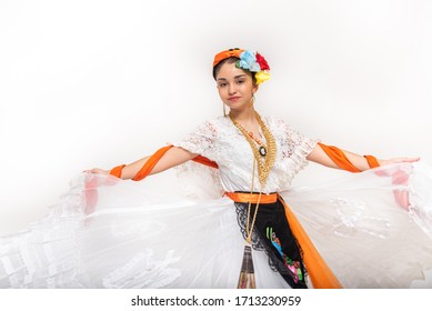 adolescent latin dancer with typical costume from veracruz mexico, jarocha woman with orange shawl, fan, flowers and mexican outfit, veracruzana coast isolated white
