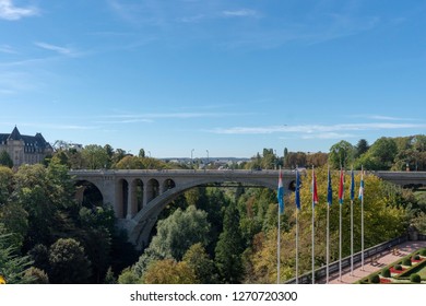Adolphe bridge in Luxembourg, bridge in the forest, old bridge, fall, flag, flagpole, europe - Shutterstock ID 1270720300