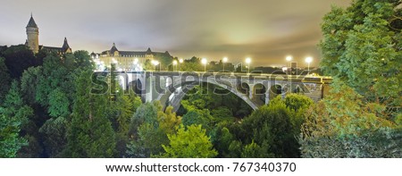 Adolphe Bridge in Luxembourg at night. The iconic arch bridge has been serving the city state since 1903.