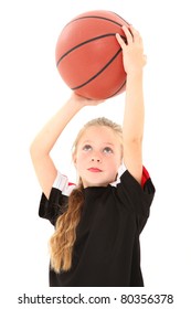 Adorable 5 Year Old Girl Child Making Free Throw With Basketball In Uniform Over White Background.