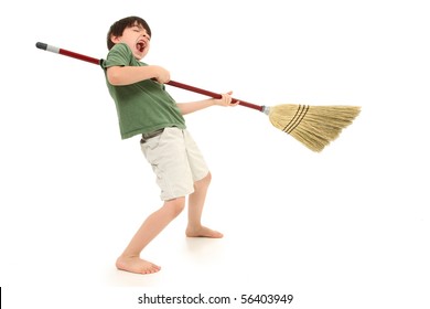 Adorable 7 Year Old Boy Child Doing Chores And Playing Air Guitar With Broom While Singing.