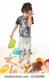 Adorable 7 Year Old Boy Making Mess Baking Cookies.