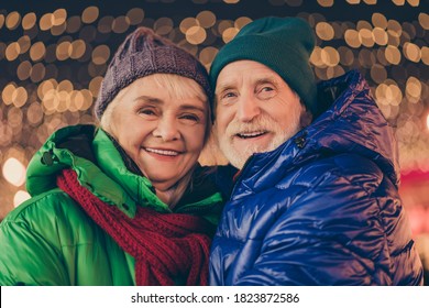 Adorable Affectionate Bonding Two Married People Old Woman Man Enjoy X-mas Christmas Jolly Holly Eve Evening Atmosphere Walk Under Lights Outdoors Wear Season Coat Headwear Scarf