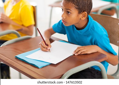 Adorable African American Primary School Student Studying Chinese In Classroom