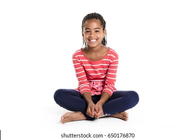 An Adorable African Little Girl On Studio White Background