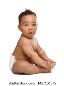 Adorable African-American baby in diaper on white background