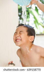 An Adorable Asian Children Have Fun In Shower