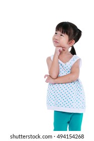 Adorable Asian Girl Thinking And Smiling. Thoughtful Child Looking Up, Isolated On White Background With Copyspace. Studio Shot.