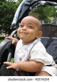 Adorable Baby Boy With Mohawk Hairdo Smirking Happy