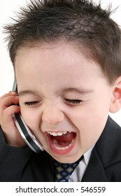 Adorable Baby Boy In Suit Yelling Into Cellphone. Focus On Mouth And Phone.