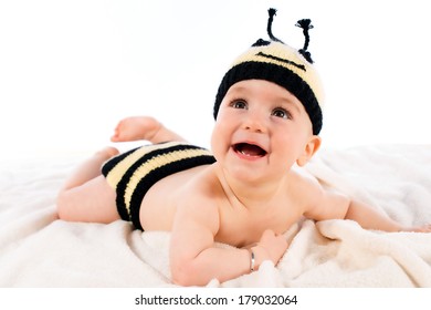 Adorable Baby Dressed In A Bee Costume On White