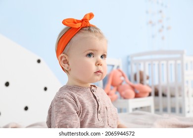 Adorable Baby Girl In Bedroom