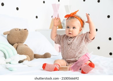 Adorable Baby Girl In Bedroom