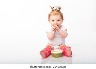 Adorable Baby Girl Eating Rice Cereal Wearing Baby Leg Warmers 