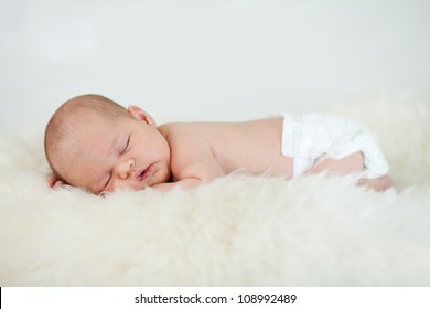 Adorable Baby Infant Sleeping On Stomach