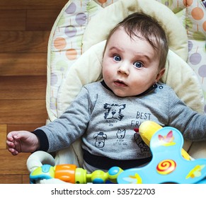 Adorable Baby In A Portable Crib