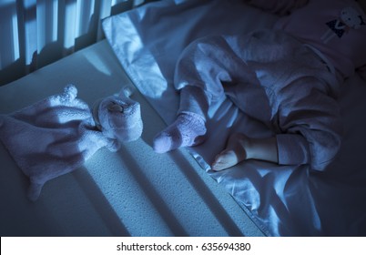 Adorable Baby Sleeping In Blue Bassinet With Canopy At Night. Bed Time For Kids. Bedroom And Nursery Interior.