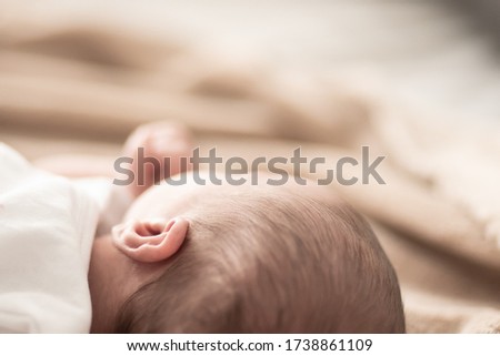 Similar – Baby sleeping on a blanket