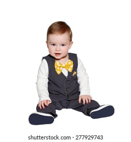 Adorable Baby Wearing Classic Vest And Colorful Bowtie On White Background