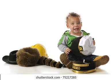 An Adorable Biracial Baby Not Sure How He Feels About An Assortment Of Hats.  Isolated On White.