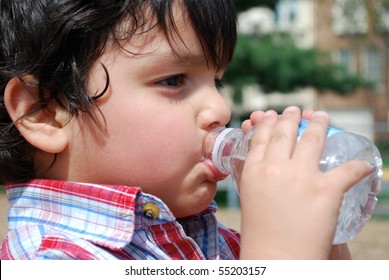 Adorable Boy Drinking Water