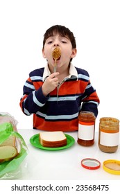 Adorable Boy Making Peanut Butter And Jelly Sandwiches